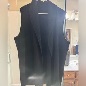 Worn very few times.  Very comfortable and reversible black vest.
